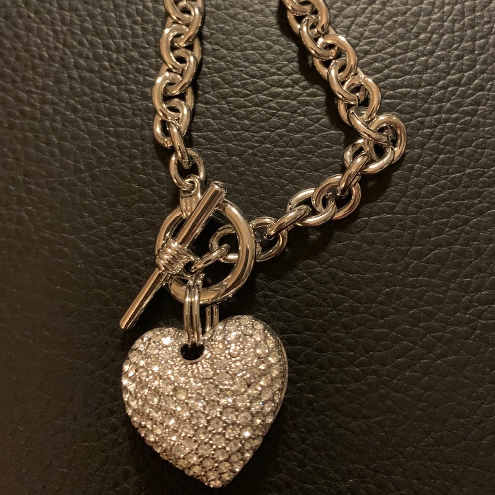 Silver tone bracelet with crystal heart charm